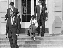 220px-us_marshals_with_young_ruby_bridges_on_school_steps
